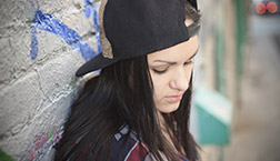 Teen girl wearing a cap
